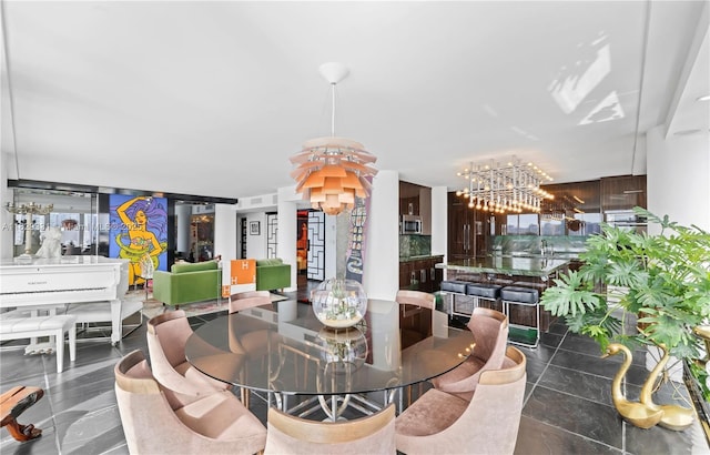 900 Bay Dr Unit 702/704, Miami Beach, FL 33141 - dining space featuring a chandelier