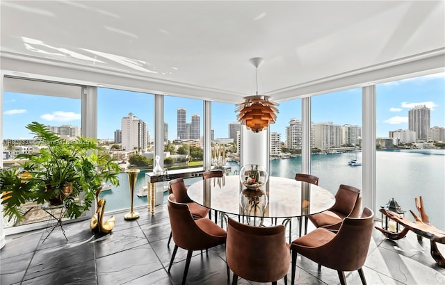900 Bay Dr Unit 702/704, Miami Beach, FL 33141 - sunroom with a skyline view, healthy amount of natural light, and a water view
