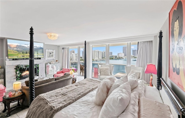 900 Bay Dr Unit 702/704, Miami Beach, FL 33141 - bedroom featuring access to exterior, a water view, and a view of city