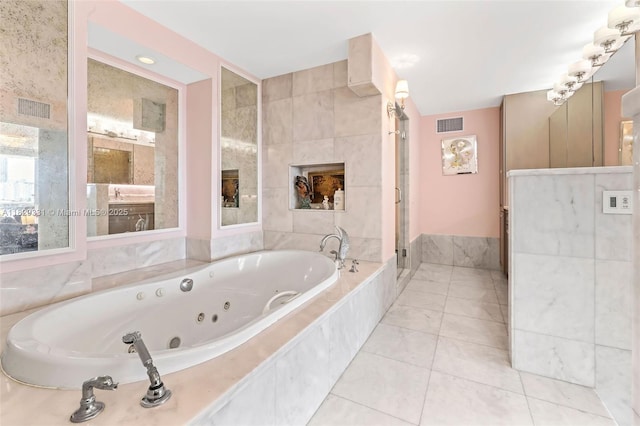 900 Bay Dr Unit 702/704, Miami Beach, FL 33141 - full bath with a tub with jets, a stall shower, and tile patterned flooring