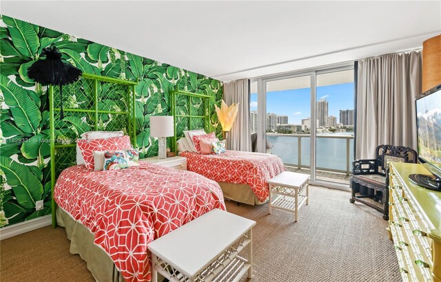 900 Bay Dr Unit 702/704, Miami Beach, FL 33141 - bedroom with access to exterior and expansive windows