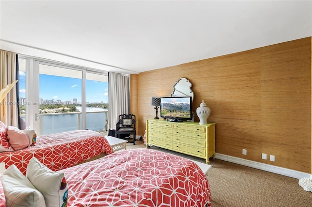 900 Bay Dr Unit 702/704, Miami Beach, FL 33141 - bedroom with access to exterior and carpet
