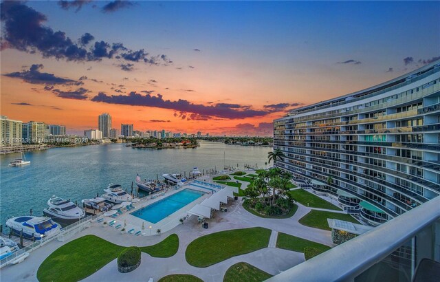 900 Bay Dr Unit 702/704, Miami Beach, FL 33141 - pool at dusk with a water view, a view of city, boat lift, and a boat dock