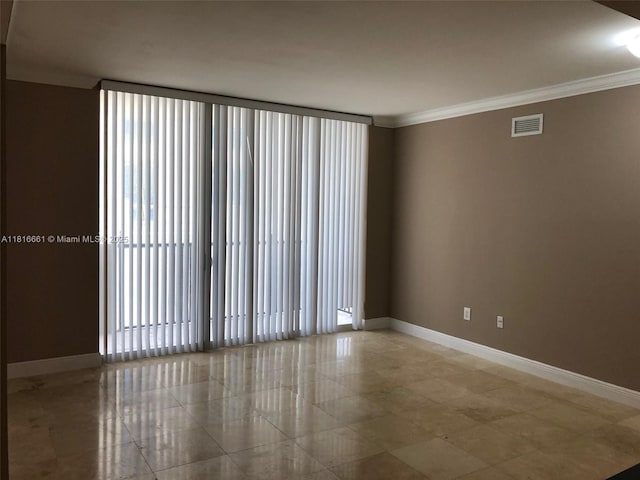 4100 Salzedo St Unit 505, Coral Gables, FL 33146 - spare room with ornamental molding and tile patterned floors