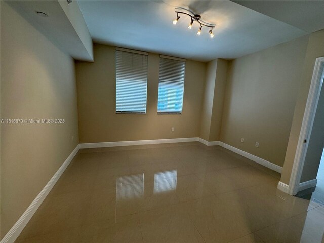 4100 Salzedo St Unit 910, Coral Gables, FL 33146 - spare room with tile patterned flooring and baseboards
