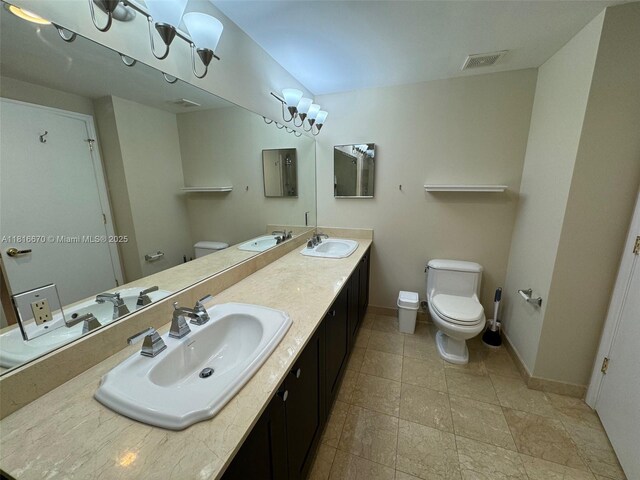4100 Salzedo St Unit 910, Coral Gables, FL 33146 - full bathroom with toilet and double vanity