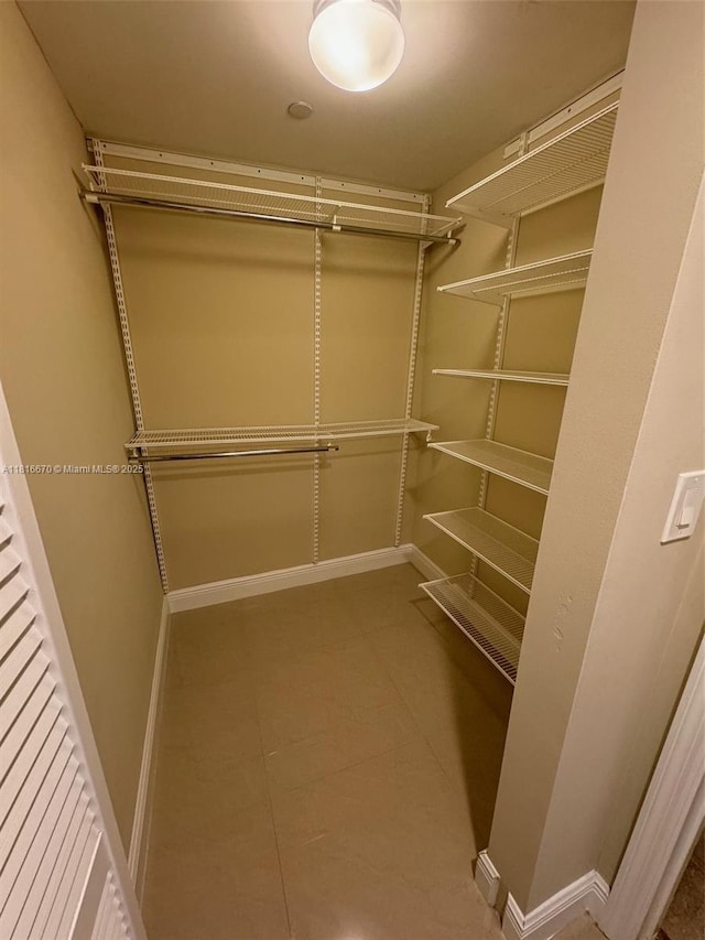 4100 Salzedo St Unit 910, Coral Gables, FL 33146 - walk in closet featuring tile patterned flooring