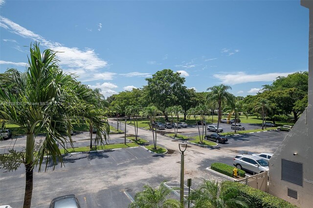 3150 W Rolling Hills Cir Unit 307, Davie, FL 33328 - view of community featuring uncovered parking and view of wooded area