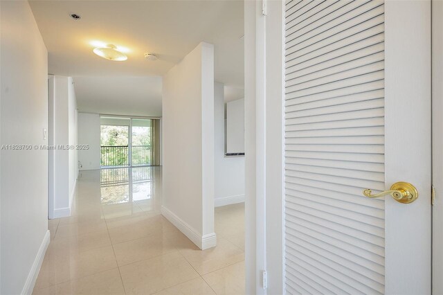 3150 W Rolling Hills Cir Unit 307, Davie, FL 33328 - hall with baseboards and light tile patterned floors