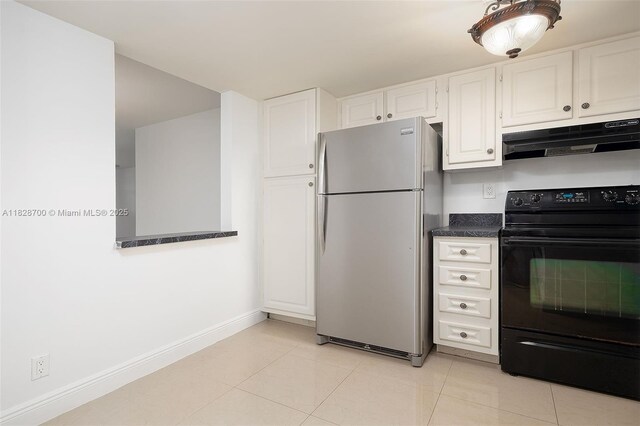 3150 W Rolling Hills Cir Unit 307, Davie, FL 33328 - kitchen featuring freestanding refrigerator, black range with electric cooktop, exhaust hood, dark countertops, and white cabinets