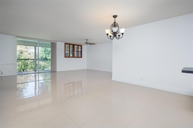 3150 W Rolling Hills Cir Unit 307, Davie, FL 33328 - unfurnished room featuring a chandelier, a ceiling fan, and a wall of windows