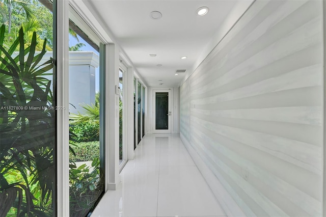 5055 N Bay Rd, Miami Beach, FL 33140 - hall featuring light tile patterned flooring and recessed lighting