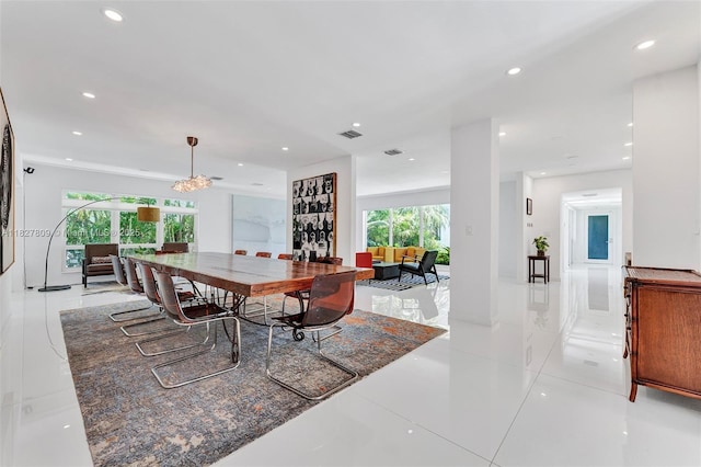5055 N Bay Rd, Miami Beach, FL 33140 - dining area with light tile patterned floors, a chandelier, and recessed lighting