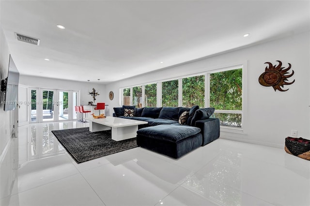 5055 N Bay Rd, Miami Beach, FL 33140 - living area featuring plenty of natural light, french doors, light tile patterned floors, and recessed lighting