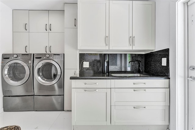5055 N Bay Rd, Miami Beach, FL 33140 - laundry room featuring cabinet space and washer and clothes dryer