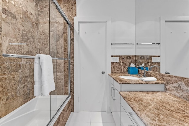 5055 N Bay Rd, Miami Beach, FL 33140 - full bathroom with vanity, tiled shower / bath, tasteful backsplash, and tile patterned flooring