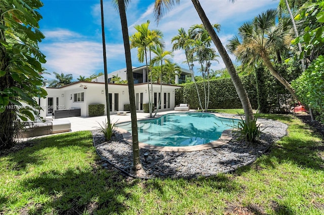5055 N Bay Rd, Miami Beach, FL 33140 - outdoor pool featuring french doors, a patio, and a yard