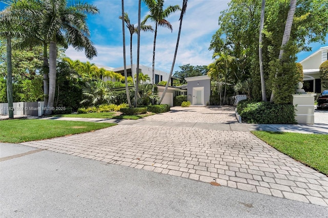 5055 N Bay Rd, Miami Beach, FL 33140 - view of front of property with decorative driveway and a front lawn