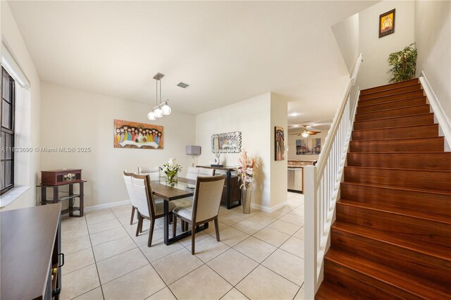 448 SE 32nd Ave, Homestead, FL 33033 - dining room with light tile patterned floors, stairs, and a ceiling fan