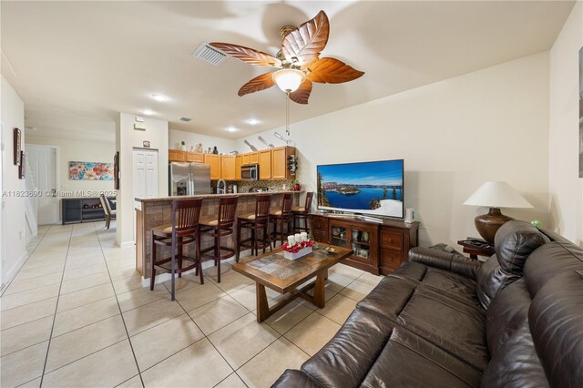 448 SE 32nd Ave, Homestead, FL 33033 - living room featuring light tile patterned floors and a ceiling fan