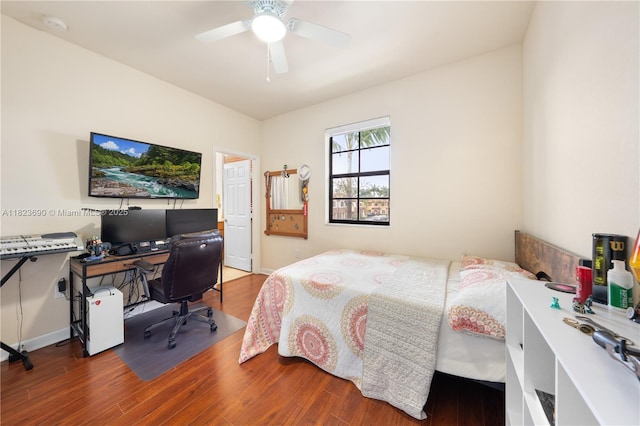 448 SE 32nd Ave, Homestead, FL 33033 - bedroom with wood finished floors, an office area, and a ceiling fan