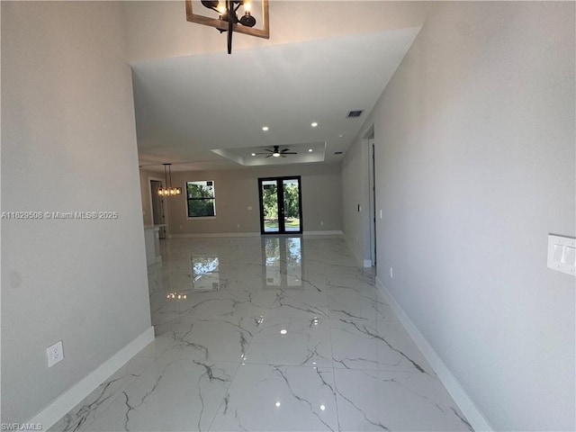 3003 18th St W, Lehigh Acres, FL 33976 - hall with light marble finish flooring, a chandelier, and recessed lighting