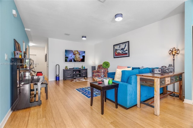 25483 SW 109th Ave, Homestead, FL 33032 - living room featuring light wood-type flooring and baseboards