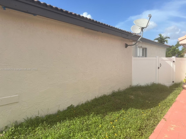 2383 SW 177th Ter, Miramar, FL 33029 - view of property exterior featuring stucco siding and a tile roof