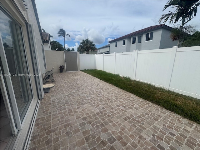2383 SW 177th Ter, Miramar, FL 33029 - fenced backyard featuring a patio