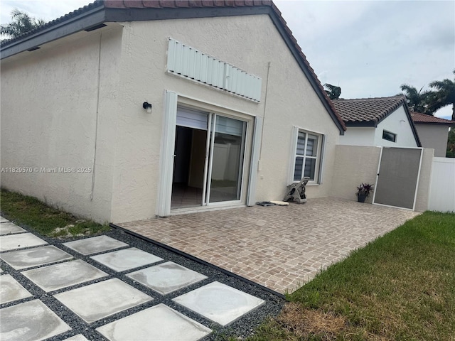 2383 SW 177th Ter, Miramar, FL 33029 - rear view of property with stucco siding, a patio area, and a tiled roof