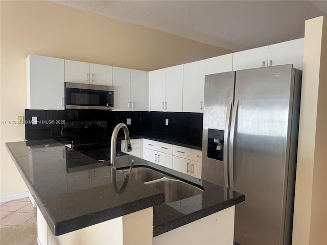 2383 SW 177th Ter, Miramar, FL 33029 - kitchen featuring appliances with stainless steel finishes, tasteful backsplash, white cabinets, and light tile patterned floors