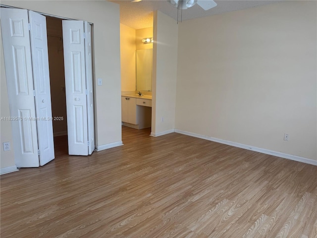 2383 SW 177th Ter, Miramar, FL 33029 - unfurnished bedroom with light wood-style floors, a closet, and ensuite bath