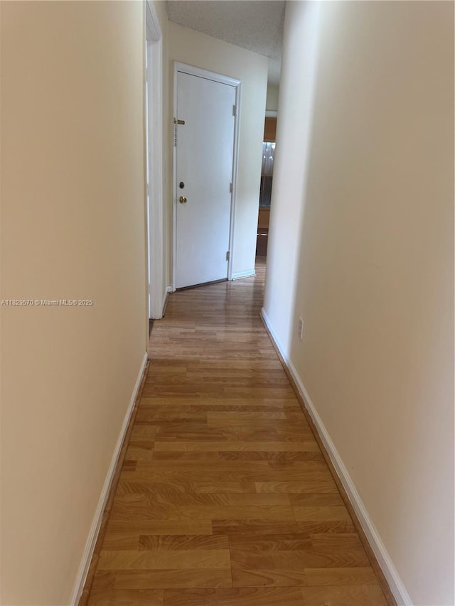 2383 SW 177th Ter, Miramar, FL 33029 - hallway with baseboards and light wood-type flooring