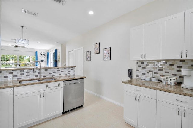 831 SW 178th Way, Pembroke Pines, FL 33029 - kitchen with stainless steel dishwasher, tasteful backsplash, white cabinetry, light stone counters, and recessed lighting