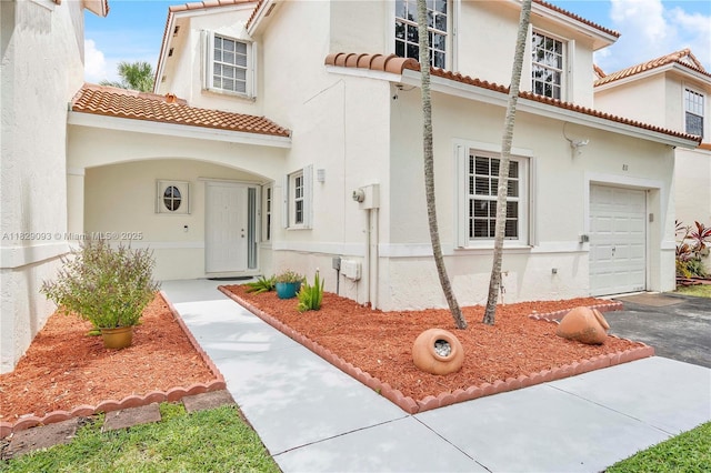 831 SW 178th Way, Pembroke Pines, FL 33029 - mediterranean / spanish home featuring a tiled roof, stucco siding, and a garage