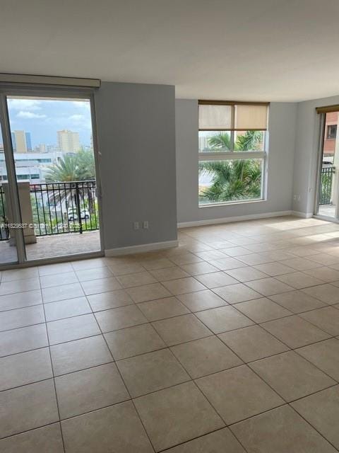 2650 SW 37th Ave Unit 501, Miami, FL 33133 - tiled spare room with baseboards