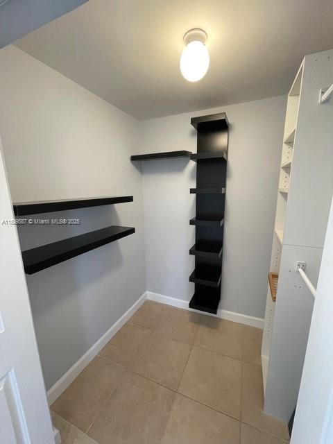 2650 SW 37th Ave Unit 501, Miami, FL 33133 - walk in closet with light tile patterned floors