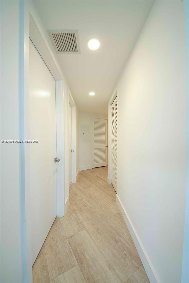 121 NE 34th St Unit 1009, Miami, FL 33137 - hallway featuring light wood-style floors and recessed lighting