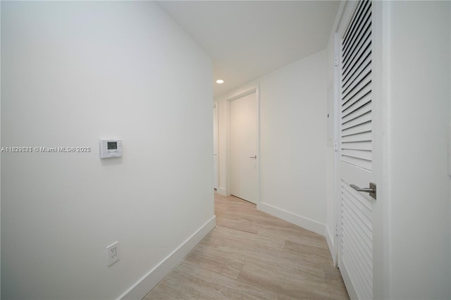 121 NE 34th St Unit 1009, Miami, FL 33137 - hallway with recessed lighting and light wood-style floors