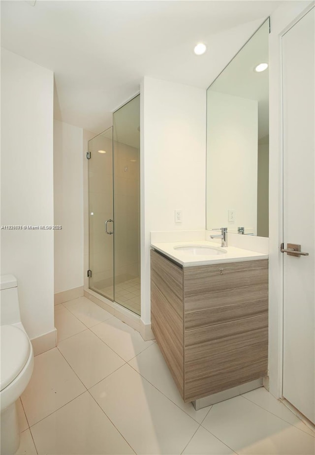 121 NE 34th St Unit 1009, Miami, FL 33137 - full bathroom featuring vanity, a stall shower, tile patterned floors, and recessed lighting