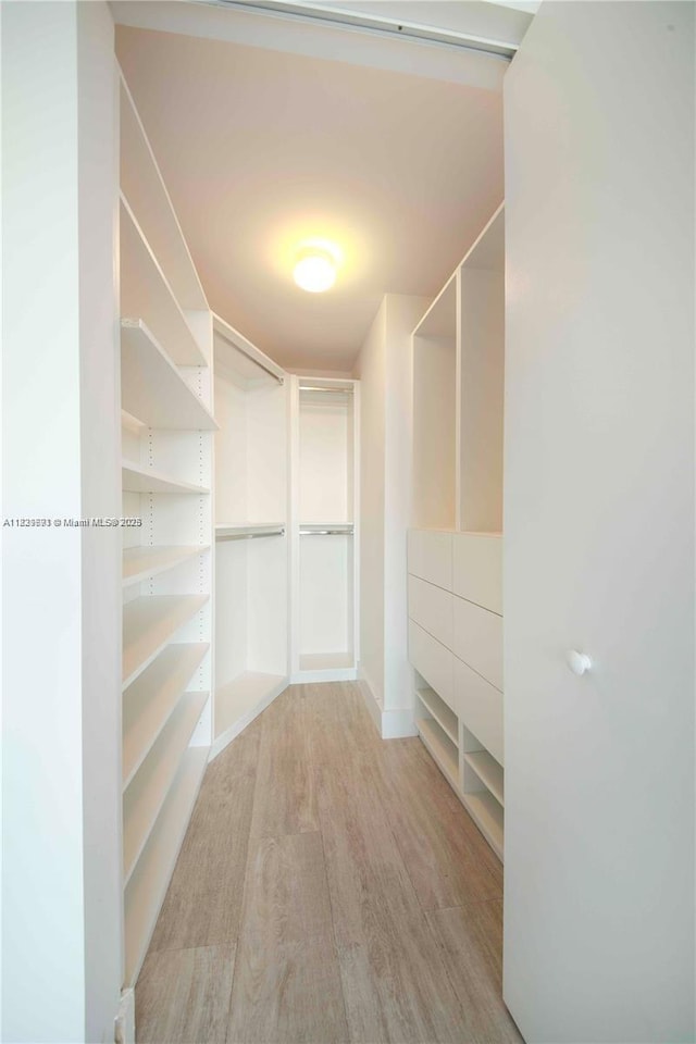 121 NE 34th St Unit 1009, Miami, FL 33137 - spacious closet featuring light wood-type flooring