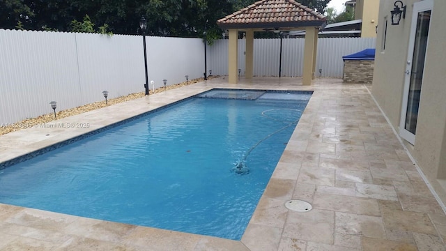 14432 SW 38th Ln, Miami, FL 33175 - view of pool with ceiling fan, a fenced backyard, a patio, and a pool with connected hot tub