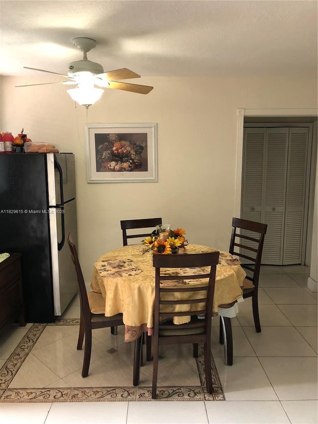 1475 NE 125th Ter Unit 301A, North Miami, FL 33161 - dining area with light tile patterned floors and ceiling fan