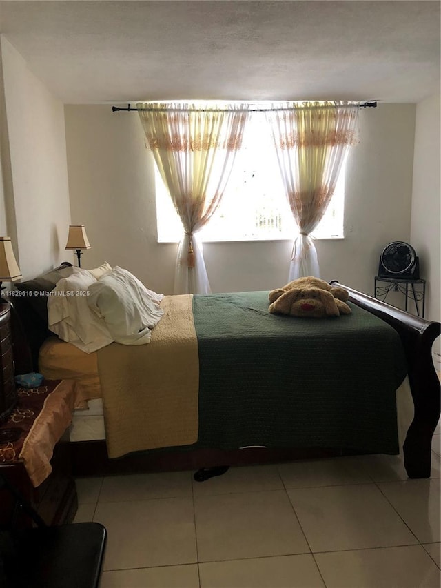 1475 NE 125th Ter Unit 301A, North Miami, FL 33161 - bedroom featuring light tile patterned flooring