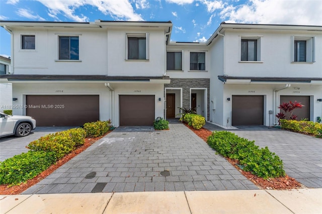 10962 SW 235, Homestead, FL 33032 - multi unit property with stucco siding, a garage, and driveway