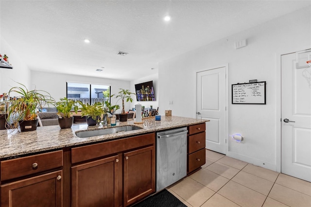 10962 SW 235, Homestead, FL 33032 - kitchen featuring stainless steel dishwasher, light stone countertops, open floor plan, light tile patterned flooring, and recessed lighting