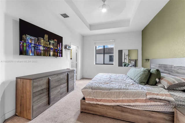 10962 SW 235, Homestead, FL 33032 - bedroom featuring light colored carpet and a tray ceiling