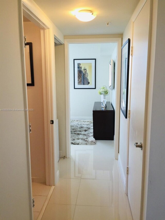 1871 NW S River Dr Unit 801, Miami, FL 33125 - corridor with tile patterned flooring and baseboards