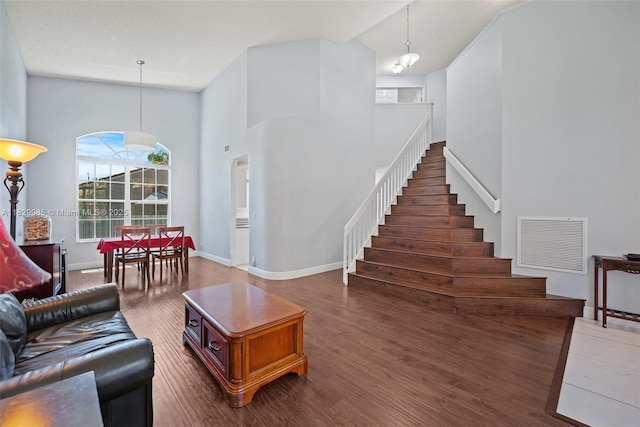 960 NW 185th Ave, Pembroke Pines, FL 33029 - living area featuring wood finished floors, stairs, and a towering ceiling