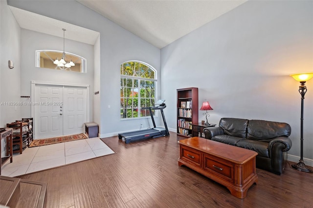 960 NW 185th Ave, Pembroke Pines, FL 33029 - living room with high vaulted ceiling, a chandelier, and wood finished floors